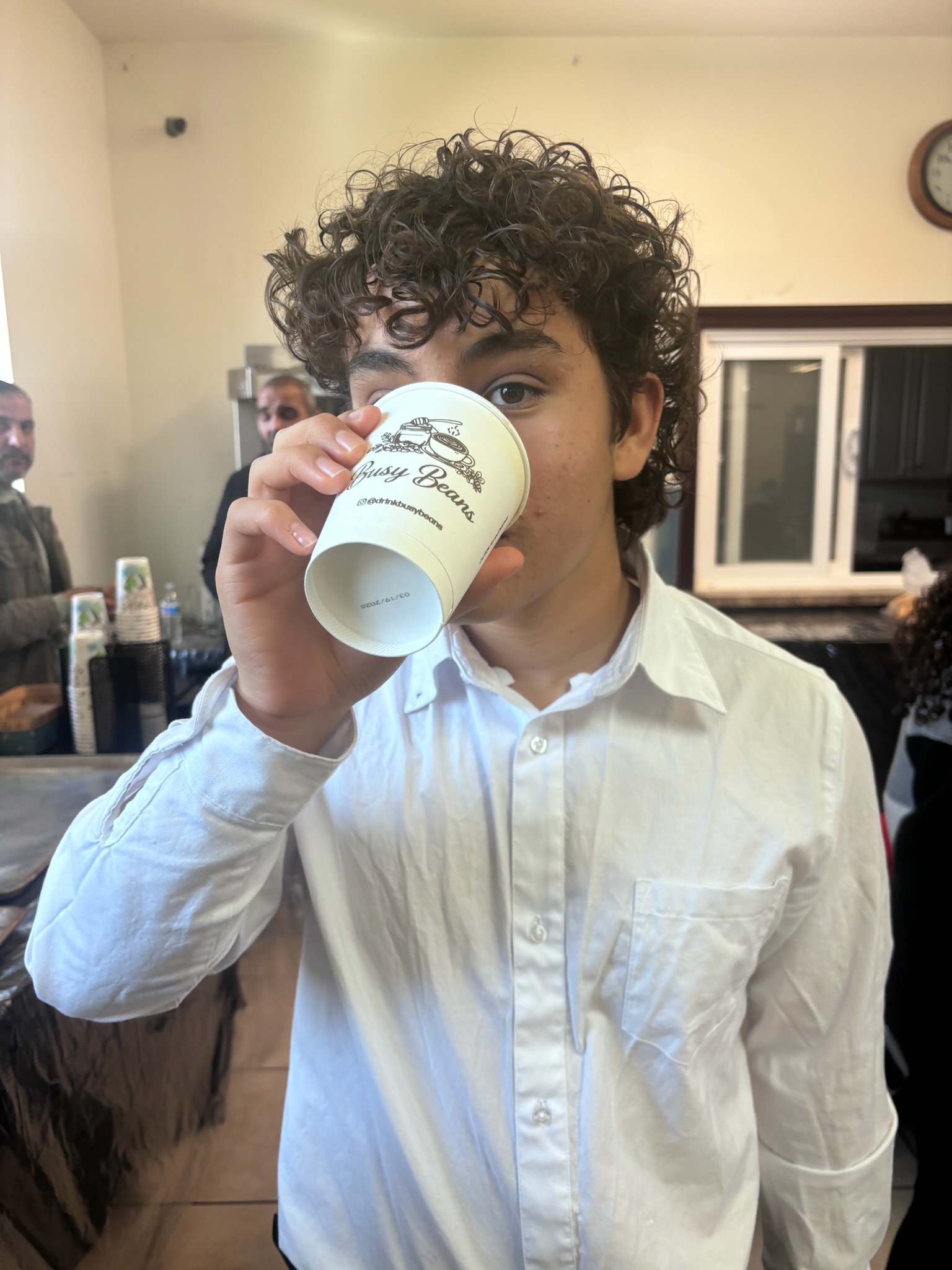 Guest at event holding a cup